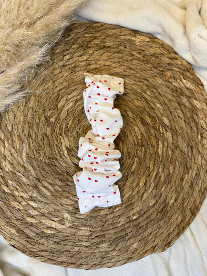 Chouchou d’allaitement en tissu fabriqué à la main.